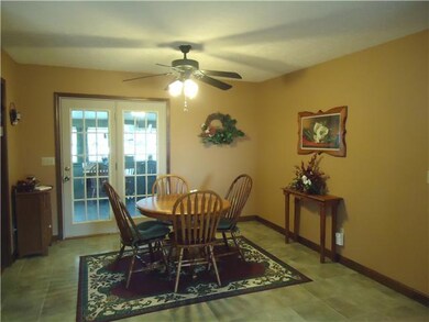 The breakfast room is spacious and has celing fan lighting. It is convenient to the kitchen, dining room and living room.
