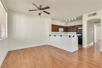 Kitchen with a breakfast bar area, light counterto