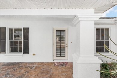 Very inviting tiled front porch