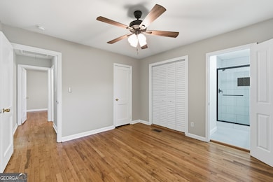 Primary bedroom with 2 closets & ensuite bathroom