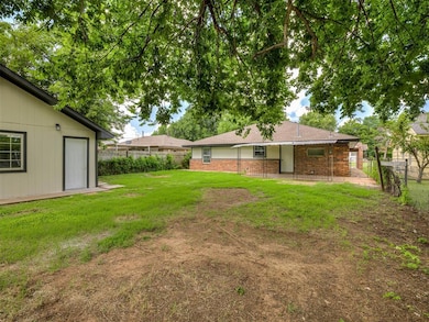 Fenced backyard with a patio area