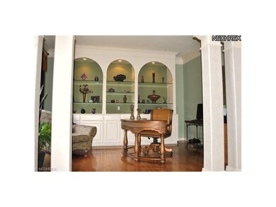 Den off Foyer with beautiful built-ins.