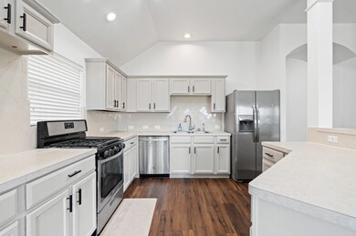 Large kitchen with high ceilings and all appliances included.
