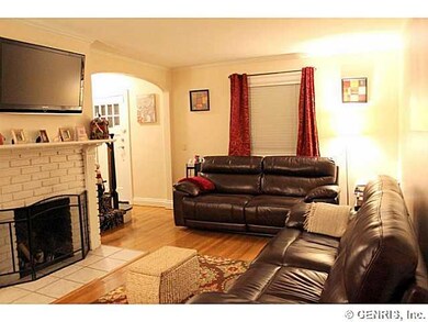 Living Room has woodburning fireplace, hardwood fl
