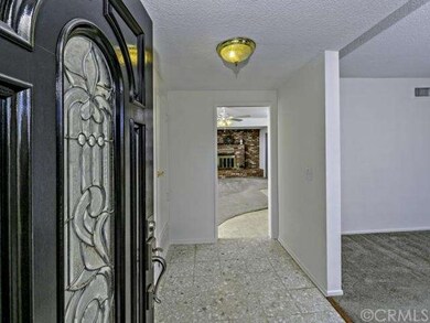 Enter through Elegant front door into Tiled Foyer 