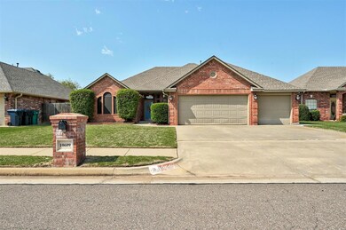 View of front of house with a garage and a front l
