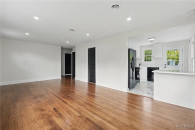 Unfurnished room featuring light wood-style floori