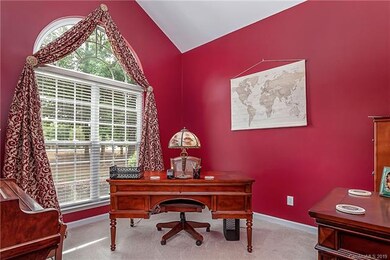 Living room at front of home could also be a library or office.