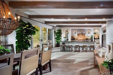 Kitchen features large kitchen island with bar sea