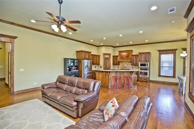 Never miss a moment, the living room, kitchen, & dining flow into each other.