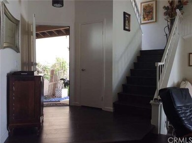 Looking at the raised entry, wood flooring and woo