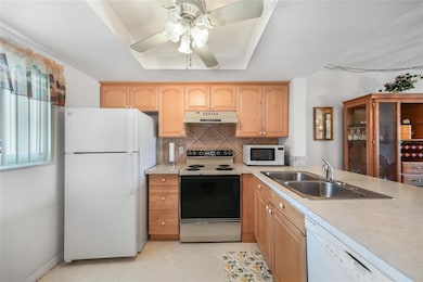 All Tile Flooring, Breakfast Bar, Pantry, Wood Cabinets