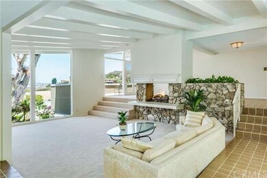 Double sided fireplace divides the living and dini
