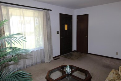 The large window in the living room provides a nic