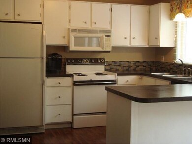 Updated kitchen with new laminate floors, glass ba