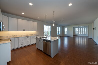 Photos are of a Belmont Plan built in a similar co