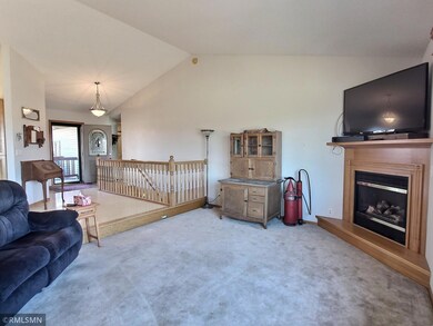 The sunken living room is centered by corner gas fireplace that warms up the area on those cold winter nights.
