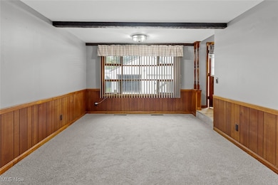 Unfurnished family room with convenient location from foyer or kitchen. Perfect for entertaining!