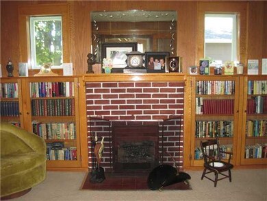 Living Room. Fireplace with book shelves built in.