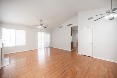 Unfurnished living room with ceiling fan, plenty o