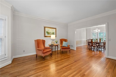 The living and dining rooms also have hardwood floors, bay windows, plantation shutters!