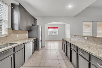 Kitchen featuring appliances with stainless steel