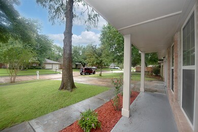 The covered front patio is the perfect spot for sitting with a favorite beverage while watching the little ones play.