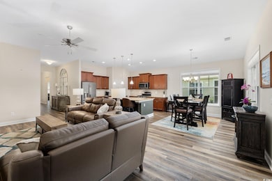 Living area featuring light wood-style flooring, c