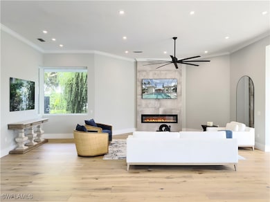 Living area featuring recessed lighting, light woo