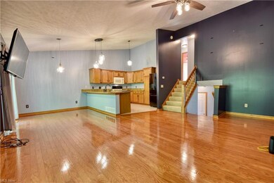 Great room open to dining area, hardwood floors, a