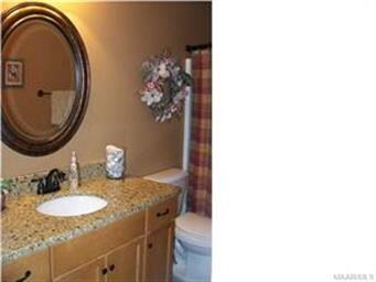 Guest bath with pretty granite countertop