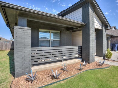 View of side of property featuring brick siding