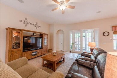 Family room with French doors leading to screened 
