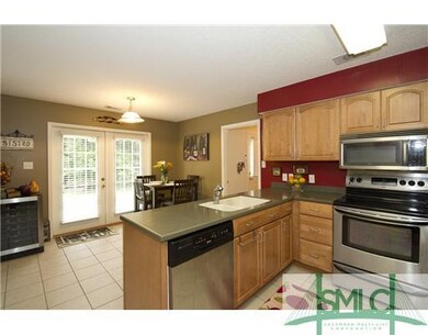 Kitchen. Corian counter tops and solid wood cabine