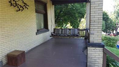 Beautiful large front porch over looks the park an