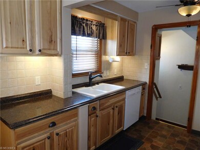 Updated kitchen with newer cabinets and tile back splash!