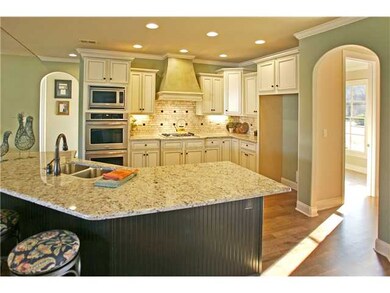 Dream chef's kitchen with custom wood cabinets, st