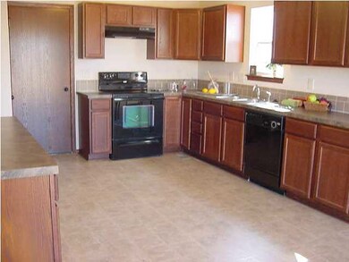 Kitchen featuring Smooth Top Range, Range Hood, Di