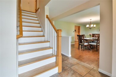 Rich woodwork accents the gorgeous staircase & nic
