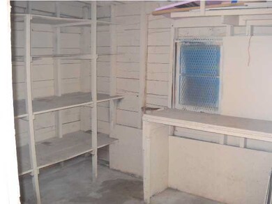 Storage room off carport