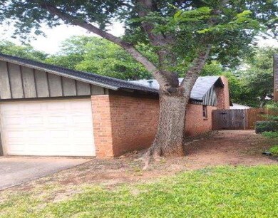 View of side of property featuring a garage