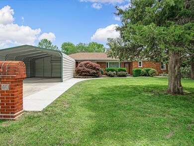 Beautifully maintained full brick ranch with a huge backyard and mature trees.