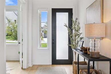 Entrance foyer featuring light wood-style floors 