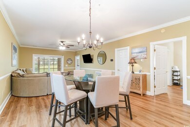 Dining room featuring ceiling fan with notable cha