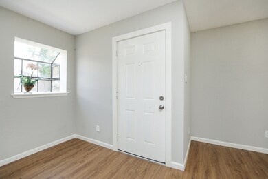 Step inside & note the beautiful garden window, Al