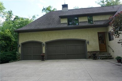 Three car attached garage with entrance to the kit