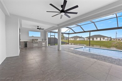 Outdoor pool featuring ceiling fan, a lanai, an ou