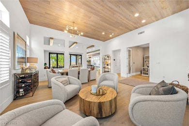 Living room with wood ceiling, recessed lighting,