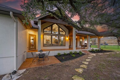 Rear view of house with a porch and stucco siding