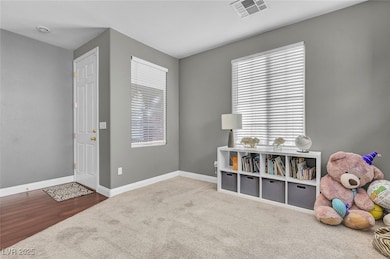 Rec room featuring carpet and wood finished floors